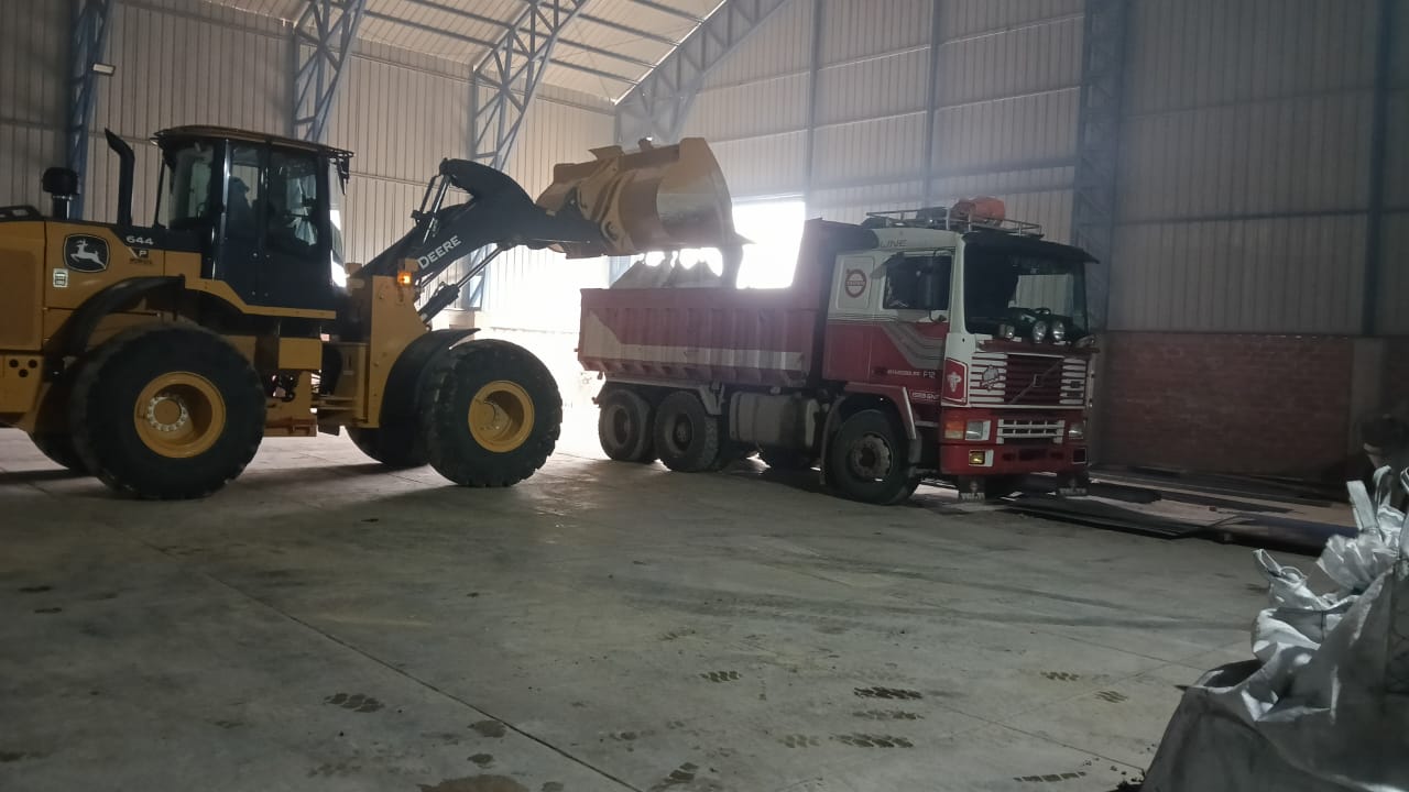 Warehouse with pallets of mineral bags ready for export