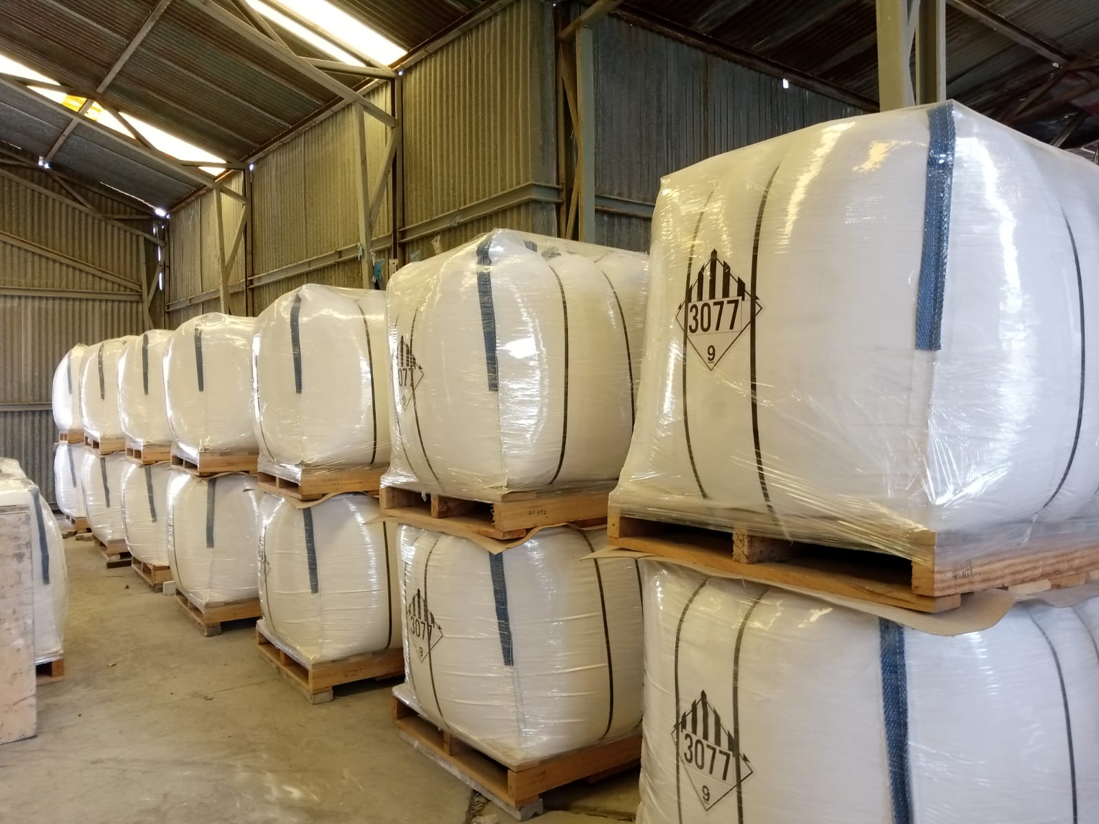 Loader and truck in warehouse